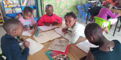 The children do homework in the library.
